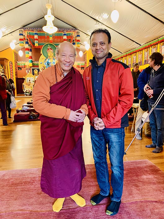 Rishi getting the blessings of a Buddhist monk at the Pema Osel Ling Monastery